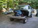 1979 Ford Bronco - This 1979 Ford F-250 truck is shown from the front with its engine compartment open and the hood off.