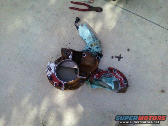 Broken transmission extension housing with red paint