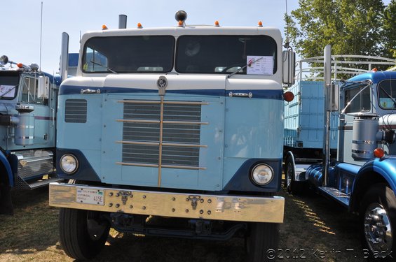 1959 Kenworth W900A truck, blue and white, front view, chrome bumper, California license plate