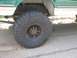 2004 Ford F-350 - Side view of a truck's rear tire and suspension components, including leaf springs.