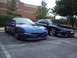 1993 Ford Probe - Two 1993 Ford Probes are parked in a lot, one blue and one dark blue.