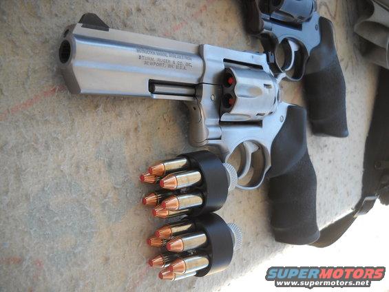 Two revolvers with speedloaders loaded with cartridges