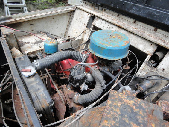 Engine bay with blue air filter and red engine block