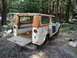 1962 International Scout 80 - This weathered 1962 International Scout 80 sits in a wooded area with its tailgate open.