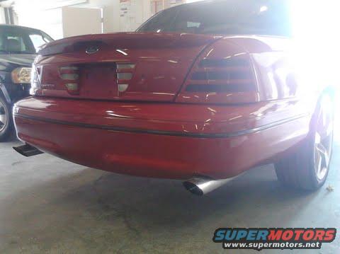 Red 1998 Ford Crown Victoria rear with dual exhaust pipes
