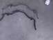 2003 Ford Crown Victoria - Two automotive sway bars are shown laid out on a concrete floor.