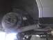 2003 Ford Crown Victoria - Close-up of a car's rear brake system, showing the rotor and caliper.