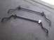 2003 Ford Crown Victoria - Two sway bars are shown on a concrete surface. The registry claims they are from a 2003 Ford Crown Victoria, but this cannot be confirmed f…