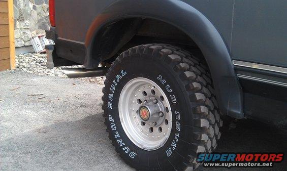 SUV rear wheel with Dunlop Mud Rover tires and chrome trim