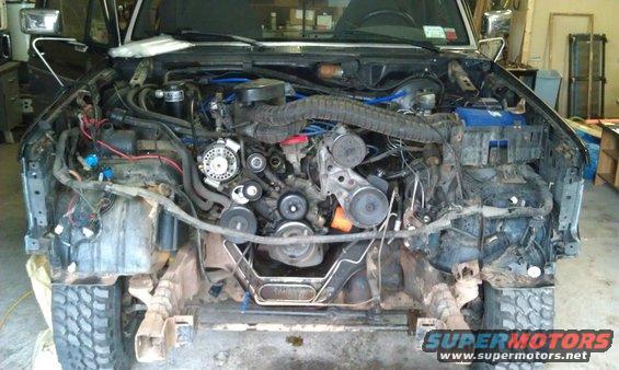 1993 Ford Bronco engine bay with front end removed, showing engine and wiring