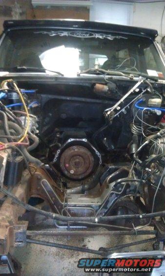 1993 Ford Bronco engine bay with transmission removed, showing engine block and frame components