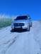2004 Dodge Durango - A silver 2004 Dodge Durango is shown driving up a dirt path under a clear blue sky.