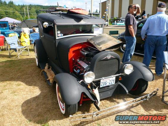 Rat rod with exposed red interior and custom grille