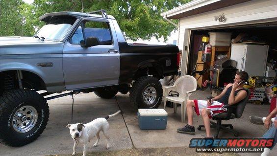 Silver and black 1994 Ford Bronco side view with lifted suspension