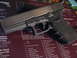 1997 Ford Crown Victoria - A Glock pistol rests on a mat displaying firearm component diagrams and text.