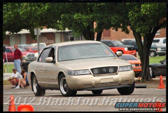 Gold 2000 Mercury Grand Marquis sedan, 3q-front view