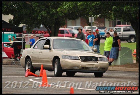 2000 Mercury Grand Marquis navigating an autocross course with orange cones