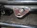 1992 Ford Bronco - Custom bracket with rubber isolator attached to vehicle frame.