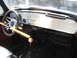 1970 Volkswagen Beetle - The interior of this classic car features a custom aluminum dashboard with various switches and gauges, along with a steering wheel lock.