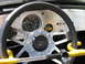 1970 Volkswagen Beetle - The custom interior of a Baja Bug features a Grant steering wheel and aftermarket gauges, indicating a modified build.