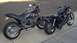 1996 Buell S1 Lightning w/Fairing - Two motorcycles are parked side-by-side on a paved surface.