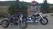 1996 Buell S1 Lightning w/Fairing - Two motorcycles are parked outside a dealership that sells Harley-Davidson and Buell motorcycles.