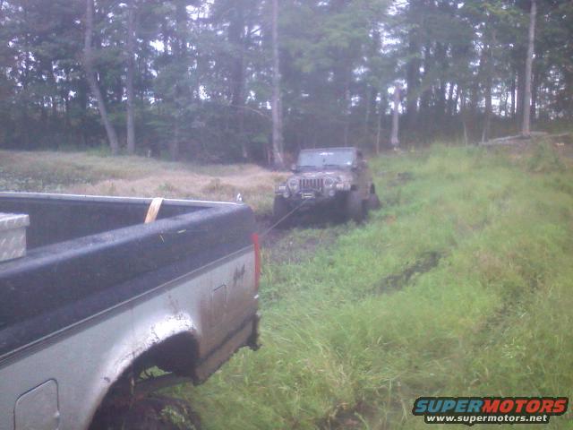 Friend sunk his jeep pretty good, hooked the winch up to my truck, by time I got to taking the picture he was pretty much out