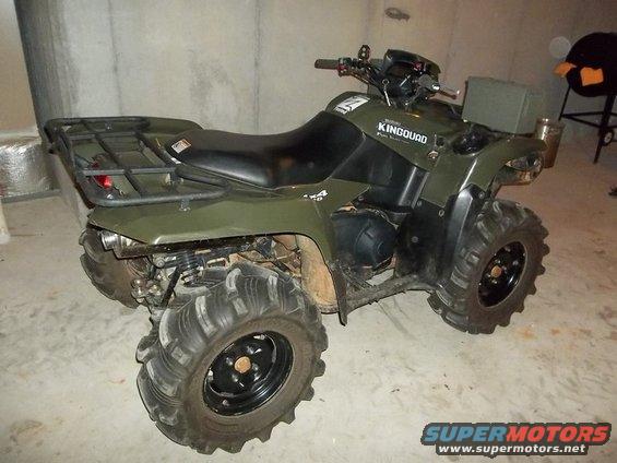 Green ATV with 'KINGQUAD' text on the side