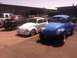 1970 Volkswagen Beetle - Three modified Volkswagen Beetles are parked outdoors, including a blue Baja Bug in the foreground.