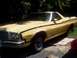 1974 Ford Ranchero - This 1974 Ford Ranchero is parked on a concrete pad with grass and trees surrounding it.