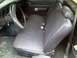 1974 Ford Ranchero - The interior of an old car shows a bench seat, steering wheel, and door panel.