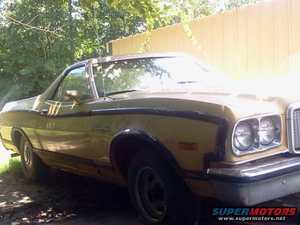 Gold 1974 Ford Ranchero with black trim, parked outdoors