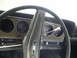 1974 Ford Ranchero - The interior of a 1974 Ford Ranchero shows its dashboard with wood grain accents and circular gauges.
