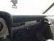 1974 Ford Ranchero - The interior of a car features a dashboard with air vents and a chrome door handle, along with a 'Black Ice' air freshener.