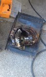 Differential assembly with exposed gears, resting on a metal plate
