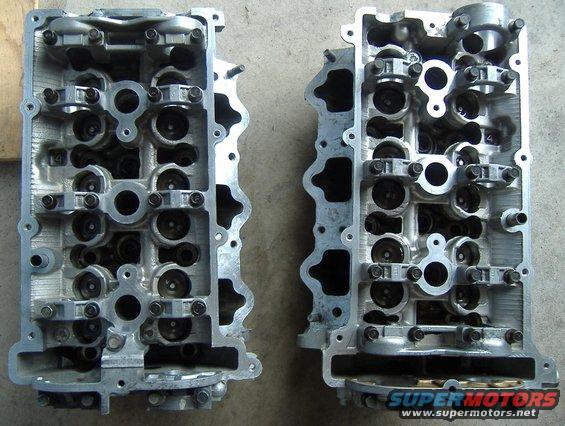 Two engine cylinder heads, one on the left and one on the right