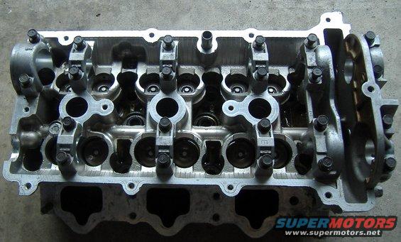 Aluminum engine cylinder head with visible valves and rocker arms
