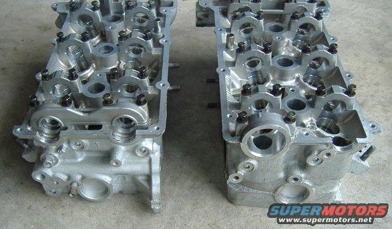 Two aluminum engine cylinder heads side-by-side