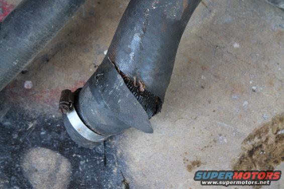Cracked radiator hose with metal clamp