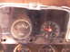 1974 Ford Ranchero - The dashboard features a fuel gauge and a clock, indicating the vehicle's current fuel level and time.