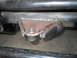 1992 Ford Bronco - Close-up view of a custom welded bracket attached to a vehicle's frame, a bolt head.