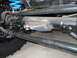 1992 Ford Bronco - Undercarriage view shows suspension parts and a portion of a tire.