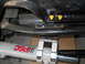 1992 Ford Bronco - Close-up view of vehicle undercarriage components, including a PSC steering cylinder.