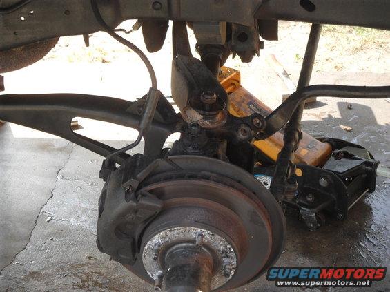 Front suspension and brake assembly with Supermotors.net logo