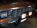 1979 Ford F-150 - Front view of a 1979 Ford F-150 showing the grille, bumper, and aftermarket pushbar with lights.