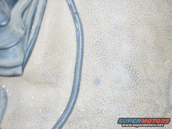Interior floor mat with ribbed conduit