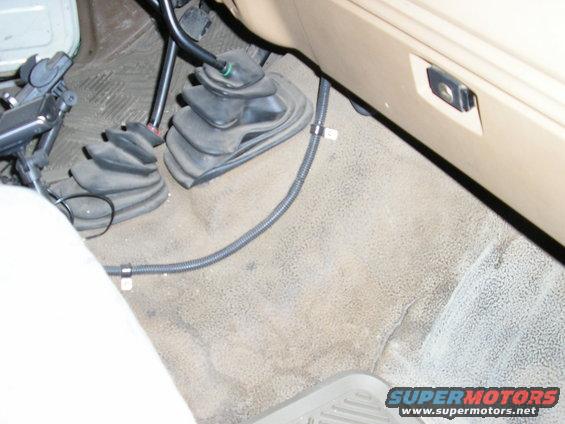 1986 Ford Bronco interior floor showing two shifter boots and carpet
