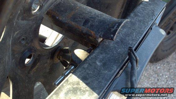 137.jpg My removable license plate bracket.  It locks in place with a locking pin, which keeps the spare tire secure.  The plate itself is secured with some special security bolts, which take a custom tool to remove.