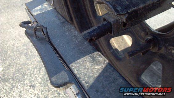 138.jpg With the locking pin removed, the light is un-plugged, and the whole bracket slides out.