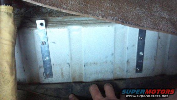 These backing plates support the air tank.  This is the hump under the rear seat.